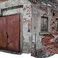 Old Industrial Factory Buildings With Weathered Brick Walls Roof Chimneys Green And Red Doors