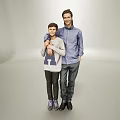 Two People in Casual Outfits Standing Together with Adult Arm Around Teen Against Light Background
