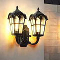 Classic Black Wall Lamps With Decorative Glass Shades Illuminated On Stone Wall