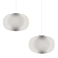 Two Beige Pleated Pendant Lights with Modern Design Hanging Against Gray Background