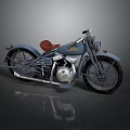 Vintage Blue Motorcycle With Red Leather Seat Chrome Engine And Spoked Wheels