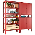 Red Storage Shelves And Cabinets With Potted Plants Terracotta Pots Wooden Crates And Books