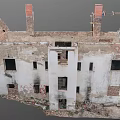 Abandoned Ruined Building With White Walls Red Chimneys And Broken Windows