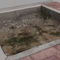 Square Area With Red Brick Border And Dirt Weeds Inside On Stone Base