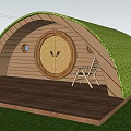 Dome Shaped Wooden Home with Green Roof Round Door Wooden Deck and Chair on Porch
