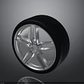 Durable Car Wheel Rim And Tire With Silver Alloy Spokes And Black Tread