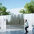 Modern Metal Entrance Gate With Textured Design Green Trees White Walls And Gray Paved Ground
