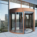 Modern Building Entrance With Bronze Revolving Door And Glass Curtain Wall
