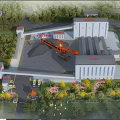 Industrial Factory Complex With Multiple Buildings Orange Crane Greenery And Roads