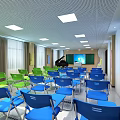 School Classroom Interior With Green And Blue Foldable Chairs Blackboard Projector Screen And Ceiling Lights