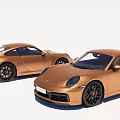 Two Golden Sports Cars With Sleek Design Black Wheels And Red Brake Calipers