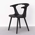 Black Modern Dining Chair With Curved Backrest And Armrests On Slim Wooden Legs