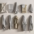 Neutral Colored Towels Hanging On Wall With Various Styles And Sizes For