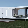 Modern White Space Capsule House With Large Glass Windows And Interior Sofa On Grass Field