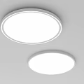 Two Round Modern LED Ceiling Lights Mounted On White Ceiling With Simple Design