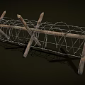 Rustic Wooden Fence Structure With Coiled Barbed Wire And Crossed Posts