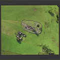 Outdoor Green Grassland Scene With Circular Structure And Small Building