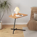 Triangular Wooden Side Table With Black Metal Frame And Table Lamp Rabbit Figurine Magazine Near Sofa Plant