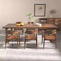 Modern Solid Wood Dining Table With Six Chairs Fruit Bowl Green Plant And White Napkin