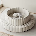 Circular Beige Sectional Sofa with Layered Structure and Plaid Cushions in Bright Wooden Floor Setting
