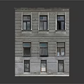 Multi Story Residential Building With Gray Stone Facade Neatly Arranged Windows And Blue Door