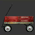 Red Metal Toy Wagon With Black Handle And White Rimmed Wheels