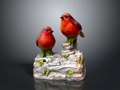 Red Bird Figurines Perched On White Base With Green Moss 3d model