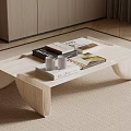 Modern Light Wood Coffee Table With Books White Cups And Tray On Beige Rug
