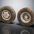Two Old Vehicle Tires with Worn Tread and Rusty Metal Rims on Reflective Surface