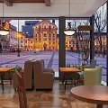 Indoor Café Space With Hanging Lights Tables Chairs Overlooking Historic Commercial Street Square At Evening