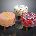 Decorative Ottoman Stools With Three Different Floral Patterns And Wooden Legs 3d model