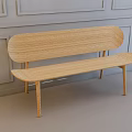 Wooden Public Bench With Minimalist Design Against Light Gray Paneled Wall