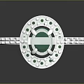 Elegant Emerald Ring With Central Green Gemstone And Diamond Accents On Silver Band