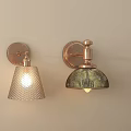 Modern Copper Wall Sconces with Textured Glass Shades Illuminated on Beige Wall