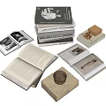 Open And Stacked Hardcover Books With Pages Illustrated Covers And Small Decorative Box