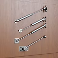 Silver Gas Struts Installed On Wooden Kitchen Cabinet Door Surface