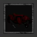Red Superhero Statue Standing On Square Base With Red Costume And Daggers
