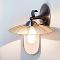 Modern Decorative Wall Light With Metal Base And Glass Shade On White Wall
