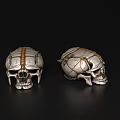 Two Decorative Skulls With Gold Silver Accents Intricate Patterns On Black Reflective Background