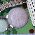 Modern Building Exterior Featuring Glass Dome Structure With Landscaped Trees And Lawn