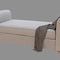 Beige Diamond Tufted Ottoman With Rolled Armrest Gold Legs And Gray Throw Blanket