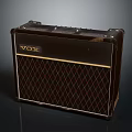 VOX Dark Brown Computer Speaker With Gold Logo Trim And Diamond Grille Design