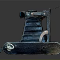 Vintage Electronic Camera Featuring Blue Green Metal Body Foldable Structure And Worn Texture