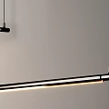 Modern Linear Pendant Light With Black Metal Frame And Warm LED Glow In Minimalist Interior