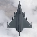 Modern Gray Fighter Jet Flying in Cloudy Sky with Landing Gear and Armaments