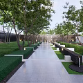 Modern Landscape Feature Wall In Garden With Green Trees Lawn And Sculpture