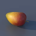 Fresh Ripe Mango with Yellow and Red Smooth Skin on Gray Background with Natural Shadow