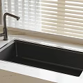 Modern Kitchen Black Sink With Faucet On Marble Countertop Near Window Blinds