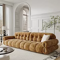 Brown Tufted Large Sofa With White Pillow In Room With Arch Window And Green Plant