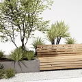 Outdoor Wooden Bench Surrounded by Green Plants and Concrete Planter on White Gravel Ground